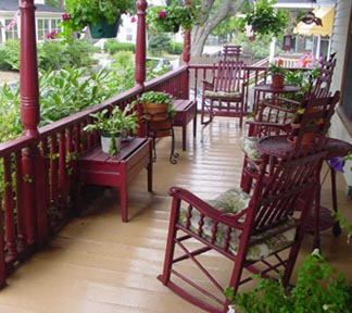 Front porch with railings and furniture